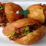 South African Vetkoek Sendok Sejagat dengan daging.