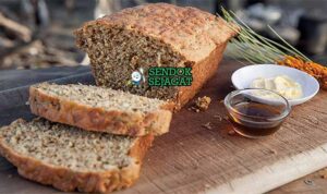 Wattleseed Damper Sendok Sejagat dengan biji wattle.