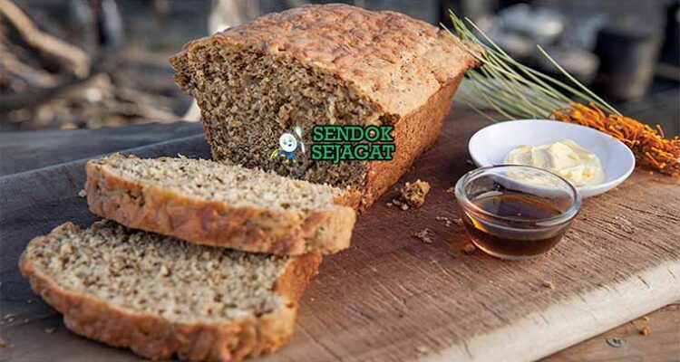 Wattleseed Damper Sendok Sejagat dengan biji wattle.