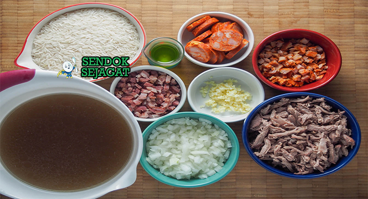 Bahan-bahan untuk Portuguese Arroz de Pato, termasuk bebek dan chorizo