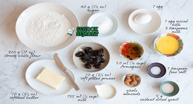 Bahan-bahan untuk Kugelhopf, termasuk tepung dan kismis
