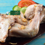 Ayam Pop khas Minangkabau dengan sambal merah dan daun singkong
