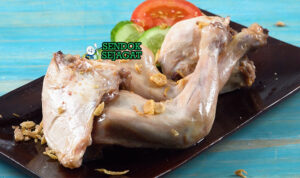 Ayam Pop khas Minangkabau dengan sambal merah dan daun singkong