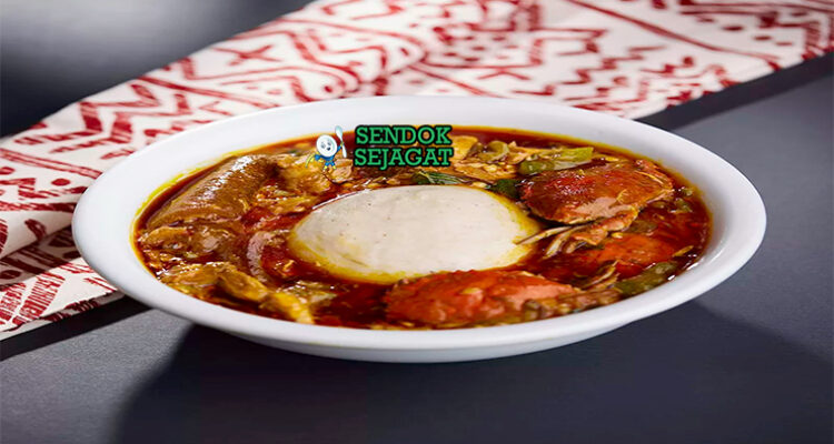 Ghanaian Banku with Okro Stew dengan daging dan cabai garnish