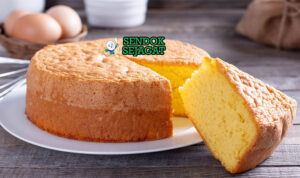 Portuguese Pão de Ló dengan taburan gula bubuk