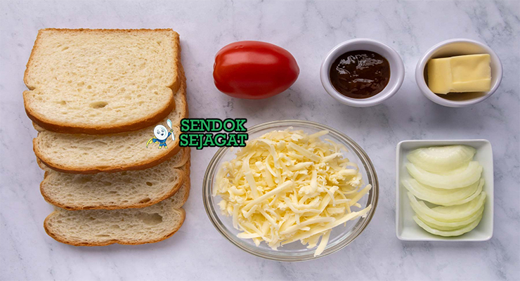 Bahan-bahan untuk Braai Broodjie, termasuk roti dan keju