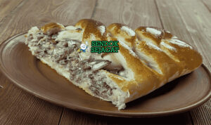 Kalakukko dengan roti rye isi ikan di piring saji