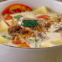 Sop Kambing Betawi dengan daging kambing dan kuah santan di mangkuk saji