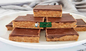 Tim Tam Slice dengan lapisan cokelat dan kelapa parut