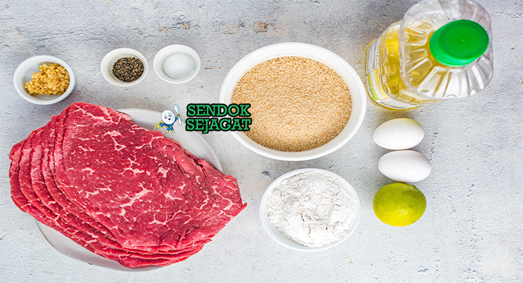 Bahan-bahan untuk Argentine Milanesa, termasuk daging sapi tipis dan tepung roti