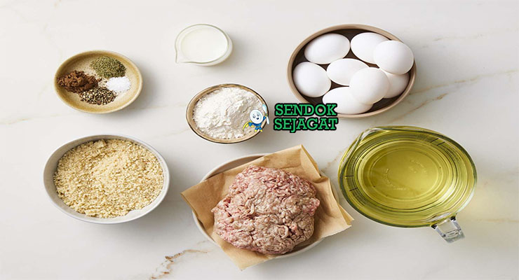 Bahan-bahan untuk Scotch Egg, termasuk telur dan daging sosis