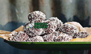 Lamington Truffles Manis Khas Australia Lamington Truffles dengan bola cokelat dan kelapa di piring saji