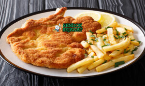 Argentine Milanesa Crispy Juicy Khas Argentina Argentine Milanesa daging goreng garing lemon fries salad di piring saji