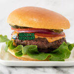 Bison Burger tall stack keju cheddar meleleh bacon caramelized onion brioche bun