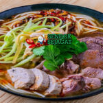 Bun Bo Hue mie creamy soup sapi lemongrass chili herb di bowl saji