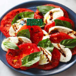 Caprese Salad tumpuk tomat mozzarella basil balsamic di piring saji