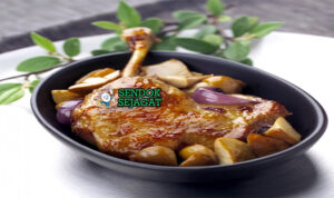 Confit de Canard paha bebek kulit crispy golden kentang sarladaise di piring putih