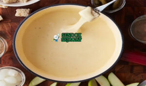 Fondue Neuchâteloise keju meleleh creamy roti celup di caquelon panas