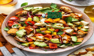 Panzanella salad roti dadu tomat basil vinaigrette di mangkuk saji