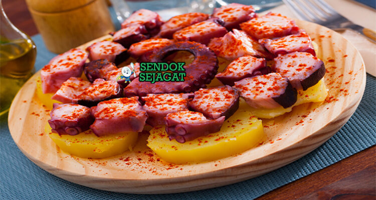 Pulpo a la Gallega iris tipis gurita empuk pimentón merah olive oil mengkilap kentang cachelos di piring kayu