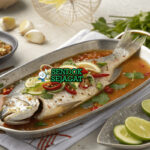 Pla Neung Manao kakap utuh kukus siram kuah jeruk nipis cabe bawang putih daun ketumbar berasap