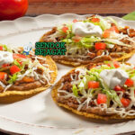 Tostadas tumpuk tinggi ayam tinga lettuce crema queso fresco aguacate salsa roja limau