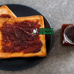 Vegemite on Toast roti panggang oles butter vegemite tipis potong diagonal di piring saji