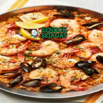 Australian Seafood Paella prawns barramundi saffron rice lemon roasted capsicum parsley paella pan