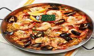 Australian Seafood Paella prawns barramundi saffron rice lemon roasted capsicum parsley paella pan