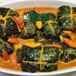 Buntil daun singkong bungkus isi kelapa parut teri kuah santan kuning cabe rawit nasi lalapan