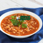 Fasolada sup kacang putih kuah tomat oregano olive oil feta olives roti crusty lemon wedges