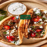 Gyros pita gulung isi daging domba sapi irisan tzatziki tomat bawang kentang goreng lemon oregano