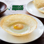 Hoppers appa bowl shape crispy edge soft center egg in middle pol sambol curry leaves