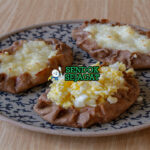 Karelian Pasties karjalanpiirakka rye oval golden ripped edge isi bubur nasi egg butter munavoi telur ham