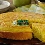 Pan de Elote potong kotak golden moist jagung utuh susu kental cinnamon powder di piring tanah liat