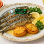 Sardinhas Assadas sardi utuh bakar arang garing garam kasar lemon wedges roti crusty salad kentang