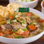 Soto Kaki Sapi kuah santan kuning iga kaki sapi besar emping bawang goreng sambal jeruk nipis nasi perkedel