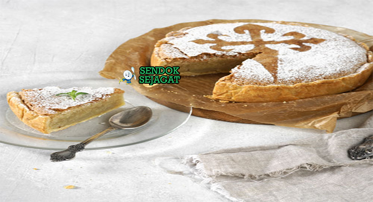 Torta de Santiago kue almond golden motif cruz salib gula bubuk potong segitiga lemon slice teh