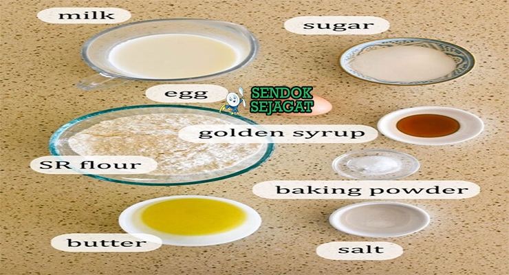 Bahan-bahan utama resep pikelets Australia: tepung terigu, baking powder, gula pasir, telur, susu full cream, vanila, dan mentega cair di mangkuk dapur