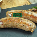 Andouillette sosis usus babi panggang renyah mustard Dijon pommes frites salad hijau piring Prancis