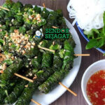 Bò Nướng Lá Lốt khas Vietnam, daging sapi cincang bungkus daun sirih panggang golden harum, disajikan dengan nước chấm rau sống bún tươi, sajian Saigon autentik