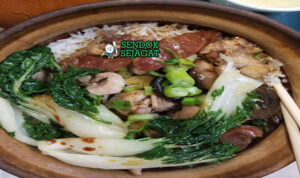 Claypot Rice nasi kerak renyah lap cheong sausage shiitake saus kecap telur setengah matang Hong Kong