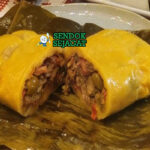 Hallaca tamales Venezuela daun pisang isi daging nasi kuning achiote arepas piring Natal Kolombia