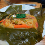 Nacatamal tamales Nikaragua daun pisang isi daging nasi kuning achiote tortilla salsa criolla piring Natal