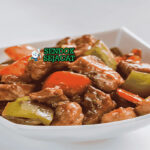 Tang Cu Li Ji iga babi goreng garing saus asam manis merah mengkilap nasi putih sayur tumis