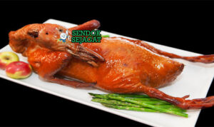 Tea-Smoked Duck bebek iris crispy kulit renyah smoky pancake hoisin daun bawang timun