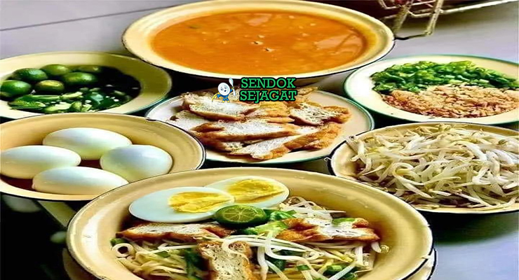 Bahan segar resep mee jawa Malaysia: mie kuning basah, daging ayam potong, santan kental, bawang bombay, bawang putih, rempah kari bubuk, kentang, tomat, tauge, telur rebus, tahu goreng di atas meja dapur kayu