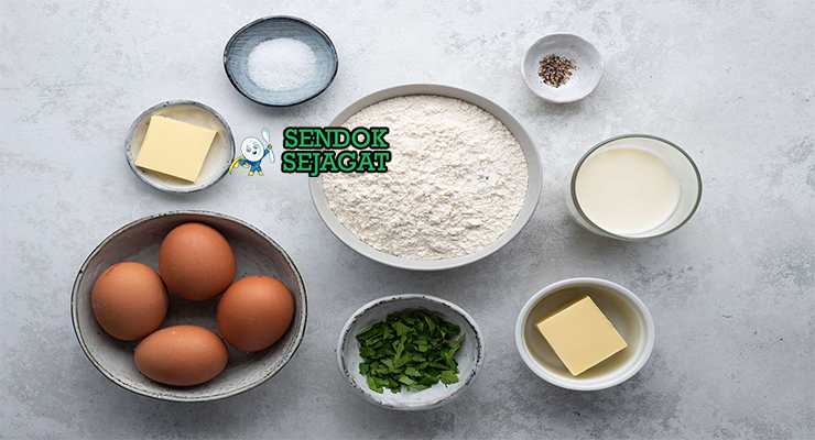 Bahan-bahan resep Spätzle termasuk tepung terigu, telur, air, garam, pala bubuk, dan mentega siap dibuat