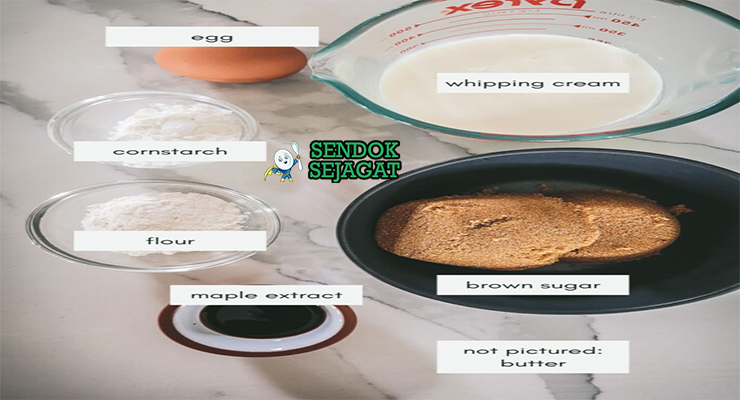 Bahan-bahan resep Tarte au Sucre termasuk gula merah, krim kental, telur, tepung, mentega, dan vanila siap dibuat