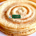 Tumpukan Canjeero khas Somalia yang lembut berpori, ditabur madu hangat, tampak segar gurih menggugah selera